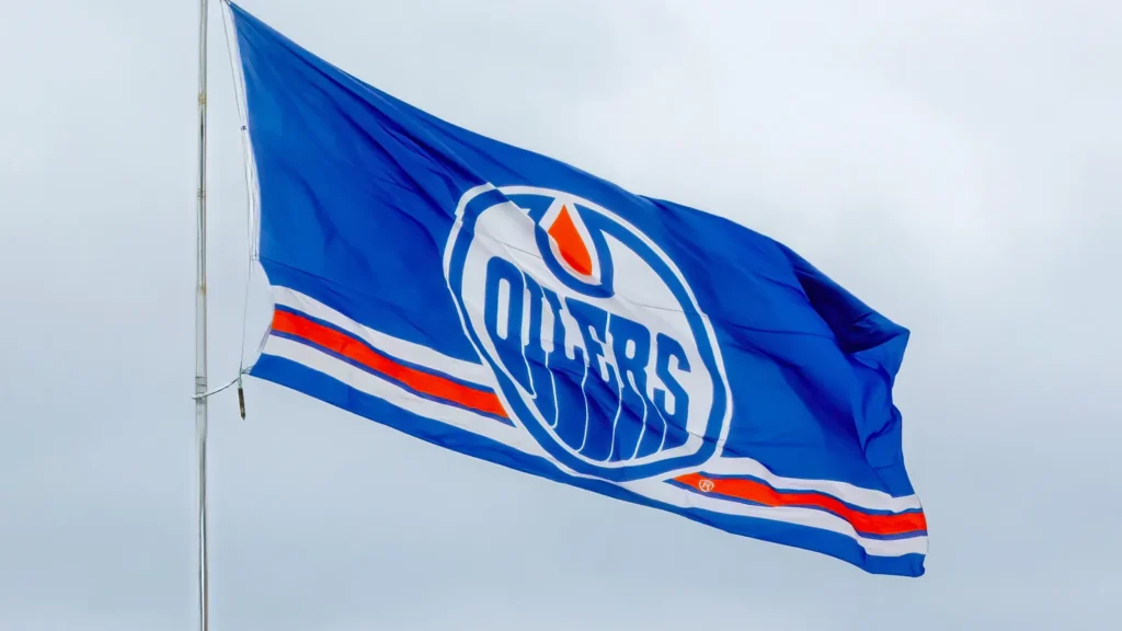 Edmonton Oilers flag waves against a cloudy sky