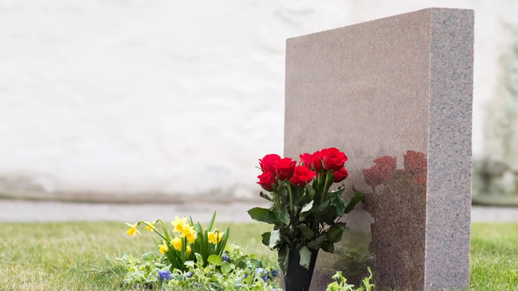 Flowers by tombstone