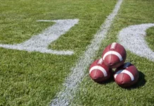The surprising reason university sports are worth millions to local businesses Footballs positioned together