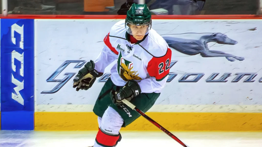 Nathan MacKinnon in action during hockey game.