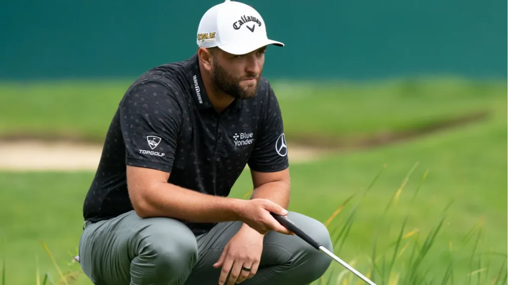 Jon Rahm assessing the golf course