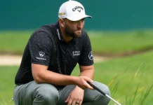 Jon Rahm assessing the golf course