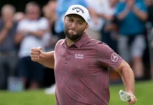 Jon Rahm putts for an eagle to go into the lead 16 under during the BMW PGA Championship