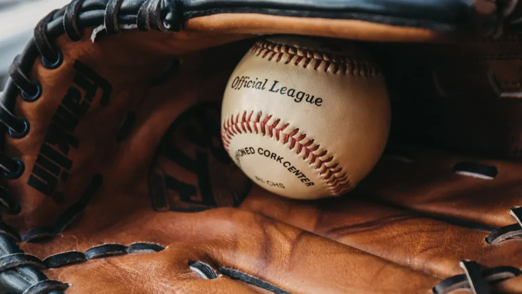 London UK  January 3 2019 Close up of a white baseball ball inside tan baseball glove Originating in England in 18th century baseball is a widely popular sport in many countries worldwide