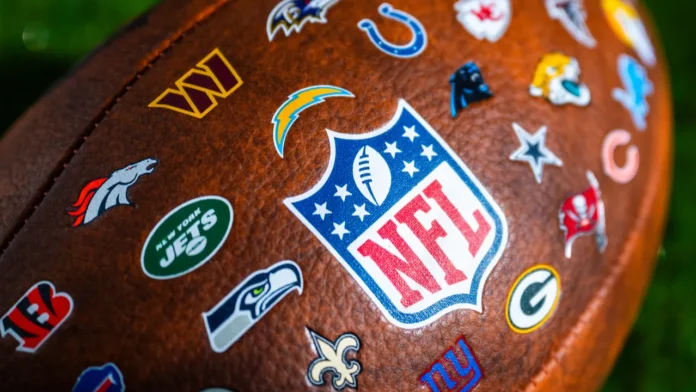 NFL All-Team Logo Football featuring the official National Football League shield logo surrounded by the throwback or current logos of all 32 NFL franchises.