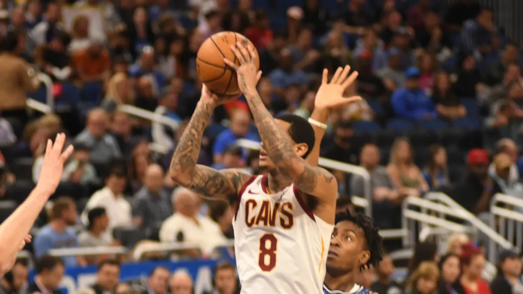 Cleveland Cavaliers' player aiming for the net during the game.
