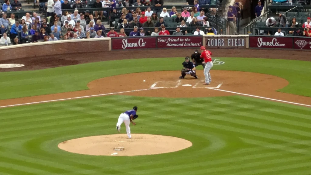 Rockies pitcher Yohan Flande throws pitch to batter with Angels