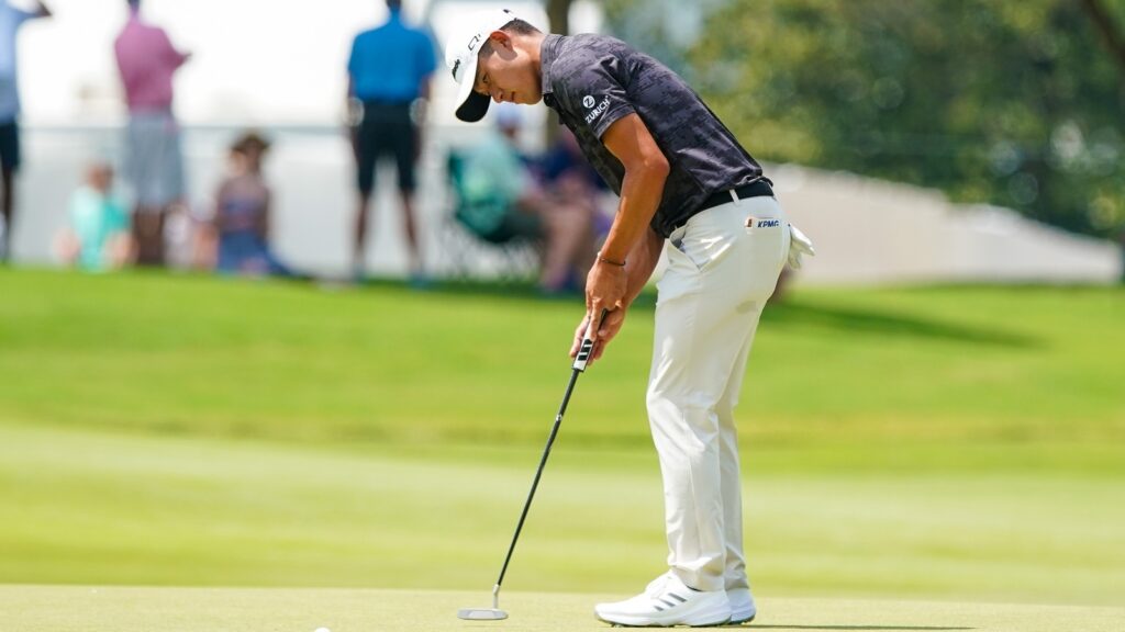Collin Morikawa (USA) putts the first green during the first round