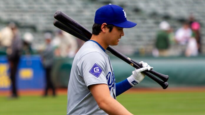 Los Angeles Dodgers designated hitter Shohei Ohtani walks on the field.