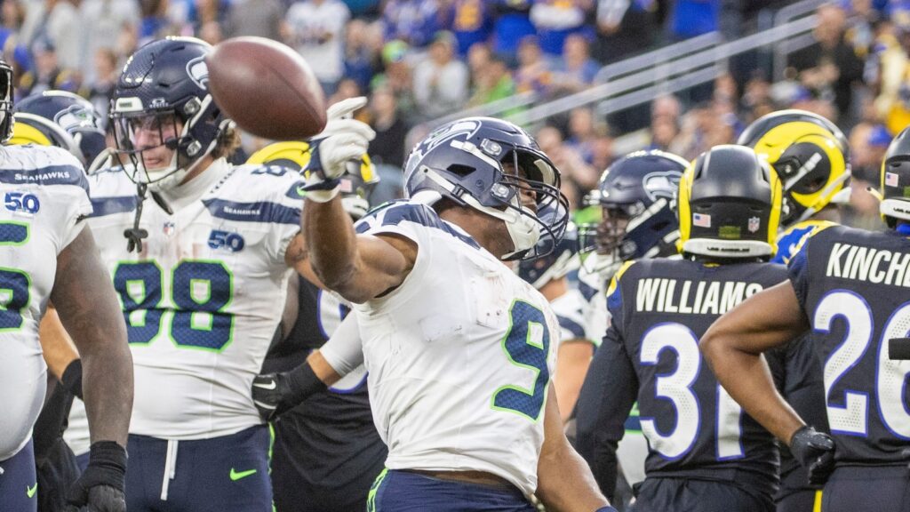 Running back Kenneth Walker III celebrates after scoring against the Los Angeles Rams
