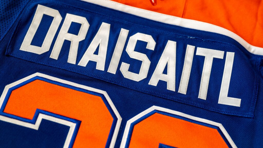 Blue and orange Edmonton Oilers hockey sweater, with name and number of Leon Draisaitl