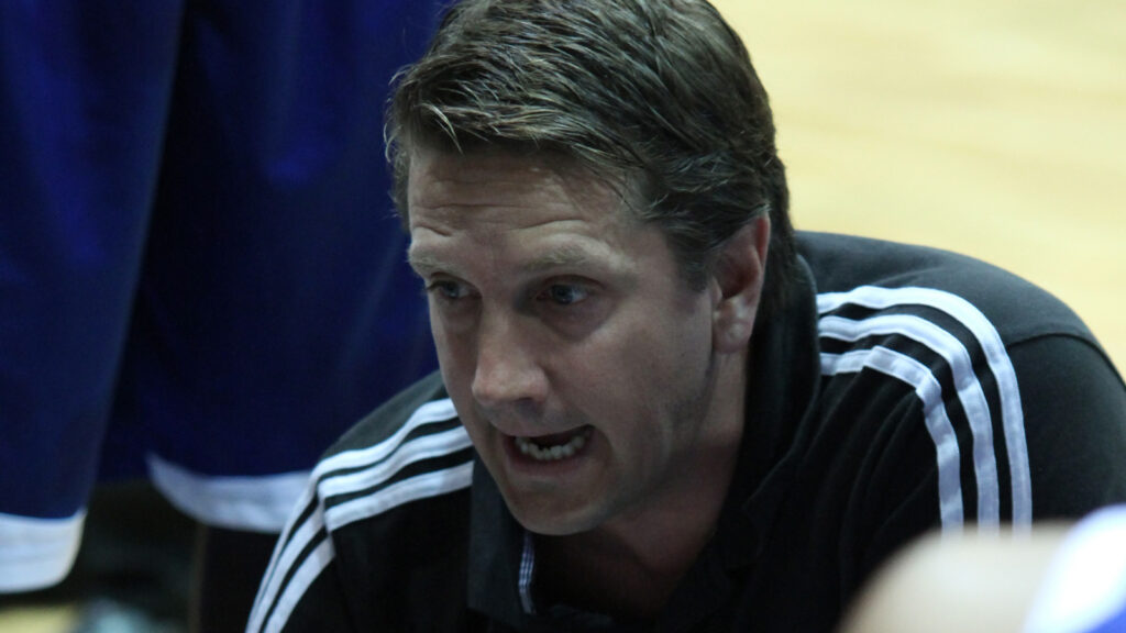 Great Britain's head coach Chris Finch talks to his players in a game against Ukraine