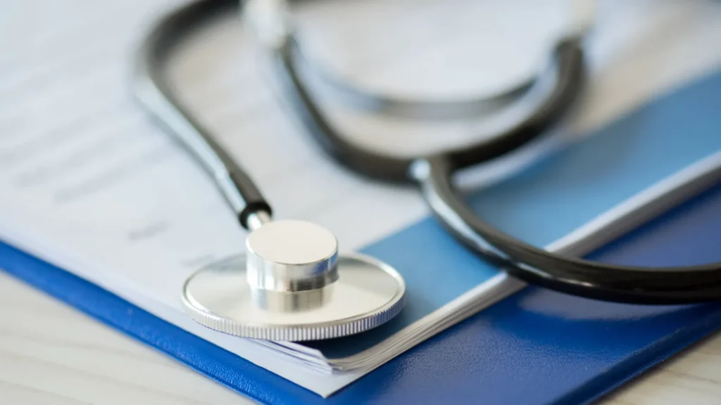 stethoscope and clipboard with diagnosis