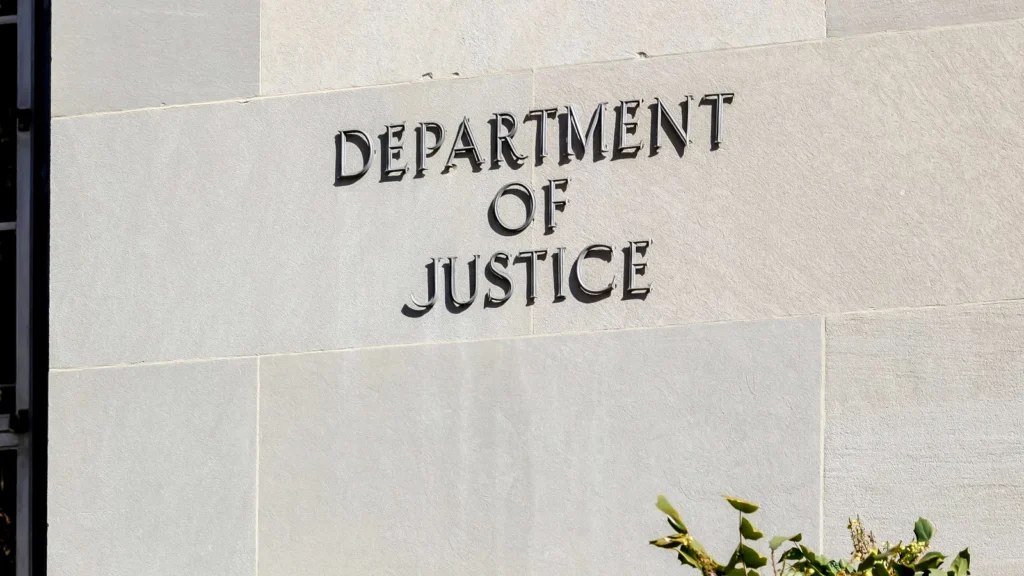 Sign of United States Department of Justice (DOJ) on their headquarters building in Washington DC, USA.