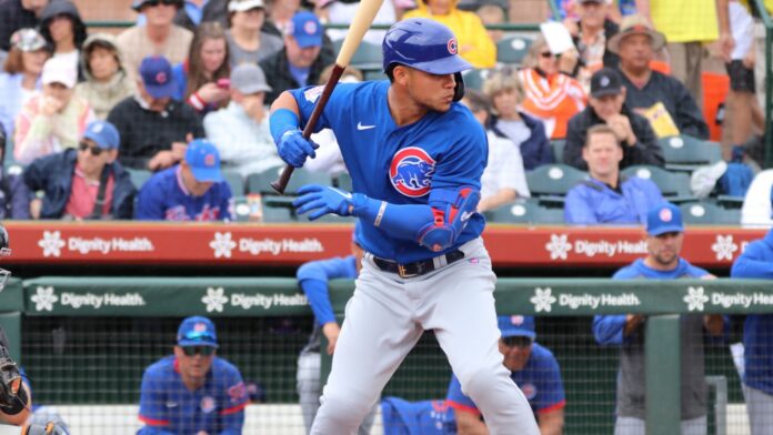 Shutterstock_Wilson Contreras _1670168782 Wilson Contreras in action during a baseball game.