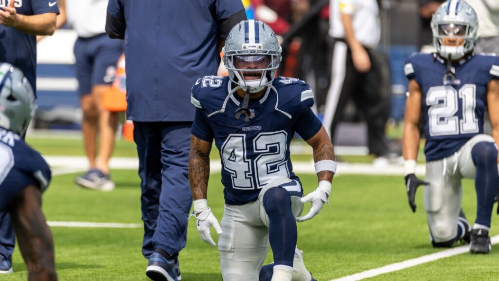 Deuce Vaughn #42 warms up before an NFL preseason football game against the Rams at SoFi Stadium.