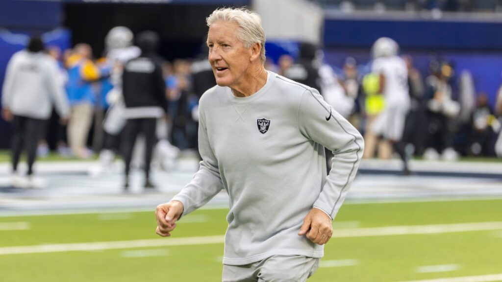 Las Vegas Raiders head coach Pete Carroll warms up before an NFL game.