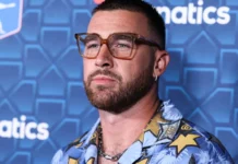 American football tight end Travis Kelce arrives at The Players Party.