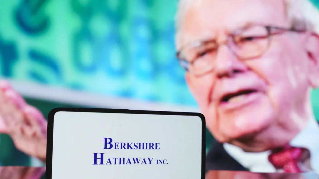 Berkshire Hathaway company and Warren Buffett in the background