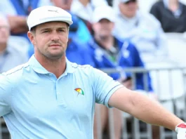 Bryson DeChambeau looks on during the game.