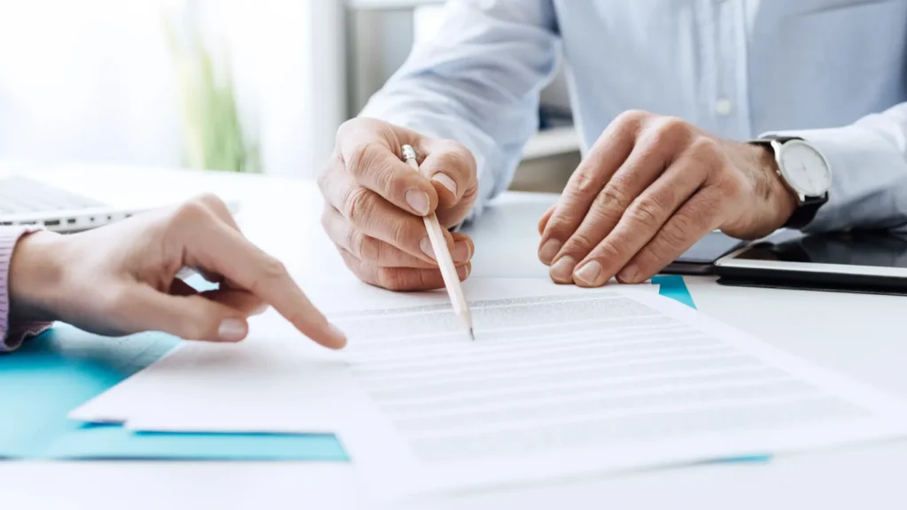Business people negotiating a contract