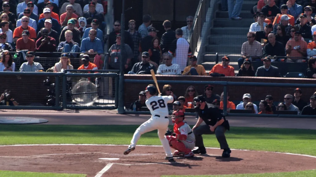 Buster Posey lifts foot as he prepares to swings at pitch