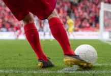 Every country knocked out of the World Cup so far Footballer takes the corner Detail of players legs and the ball during soccer match