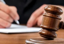 Attorneys cite independent autopsy finding in Doug Martin custody death case Judge and lawyer in a courtroom