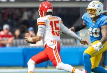 Patrick Mahomes runs to escape a tackle