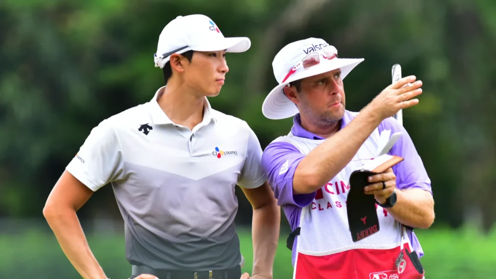 Whee Kim, of South Korea, and his caddie at TPC KUALA LUMPUR.