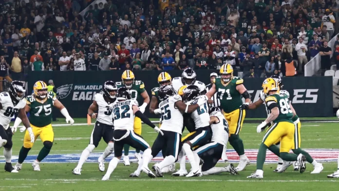 Philadelphia Eagles executing their signature "tush push" (also known as the "Brotherly Shove") against the Green Bay Packers