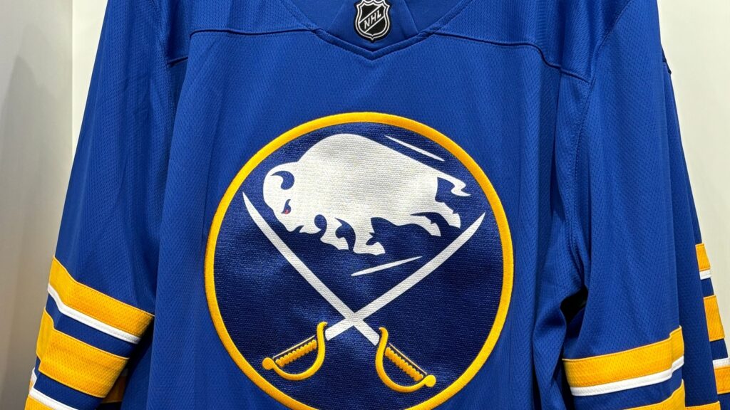 Blue and yellow Buffalo Sabres jersey in a store
