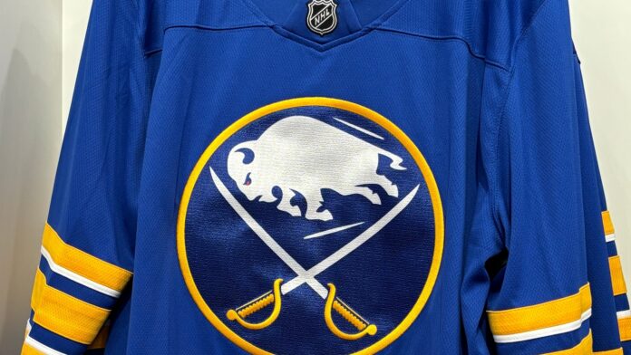 Blue and yellow Buffalo Sabres jersey in a store