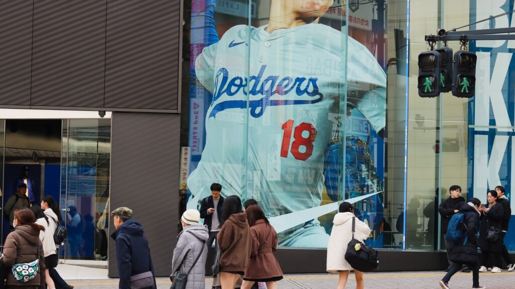Nike store with an advert featuring featuring baseball player Yoshinobu Yamamoto a big screen