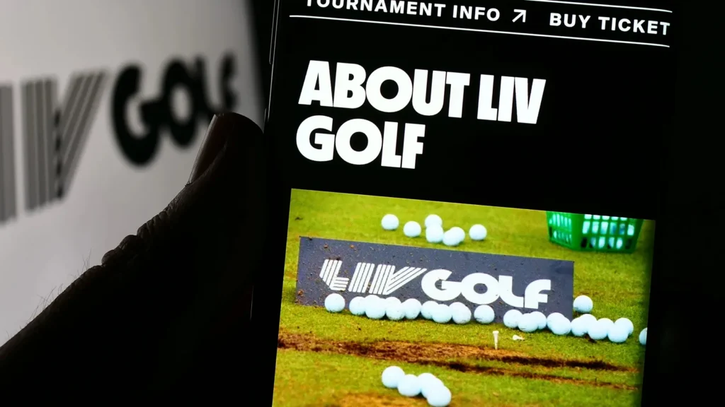 Person holding smartphone with website of sports organization LIV Golf on screen in front of logo.