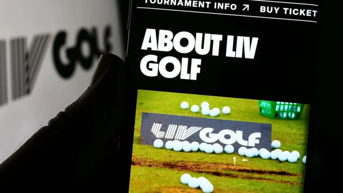 Stuttgart Germany 07172023 Person holding smartphone with website of sports organization LIV Golf on screen in front of logo Focus on center of phone display Person holding smartphone with website of sports organization LIV Golf on screen in front of logo.