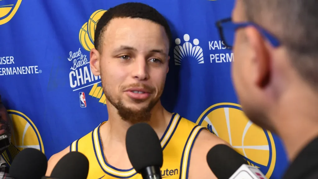 Stephen Curry speaks to reporters during a Golden State Warriors media interview.