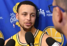 Steph Curry reacts after former Warriors coach Mike Brown leads Knicks to title Steph Curry speaks to reporters during a Golden State Warriors media interview