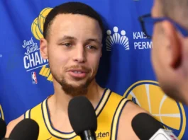 Steph Curry speaks to reporters during a Golden State Warriors media interview