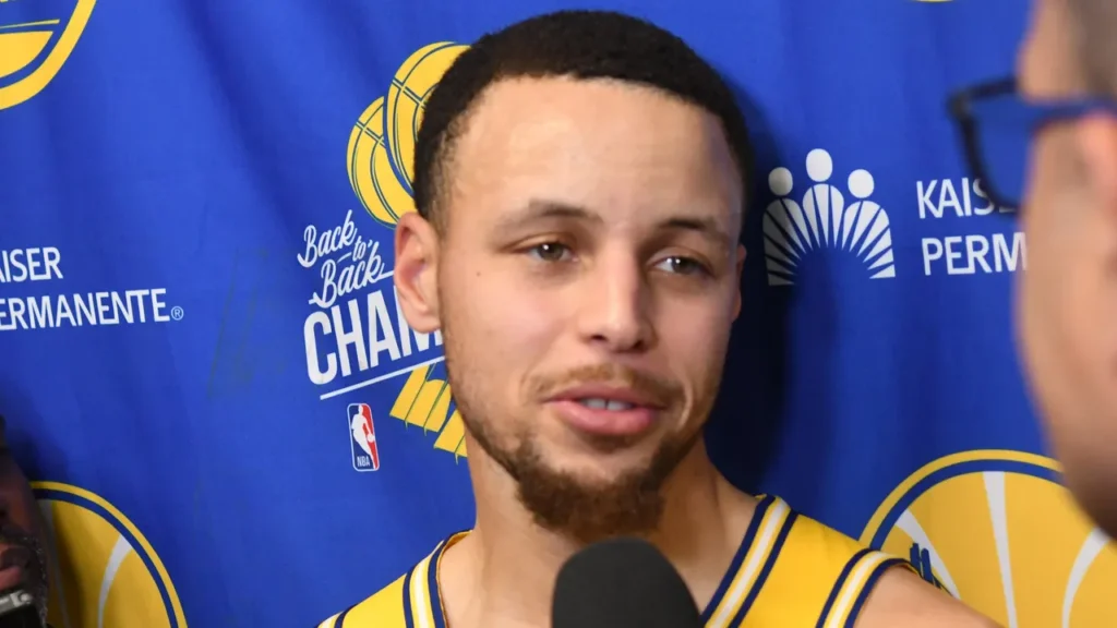 Steph Curry speaks to reporters during a Golden State Warriors media interview.