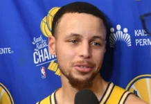 Steph Curry speaks to reporters during a Golden State Warriors media interview.
