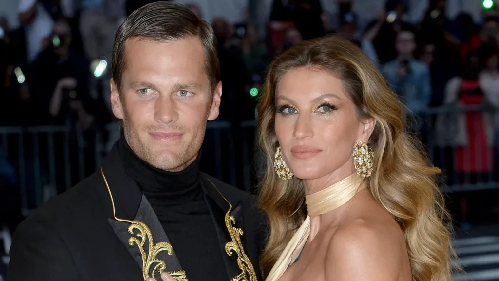 Tom Brady and Gisele Bündchen posing together at a public event.