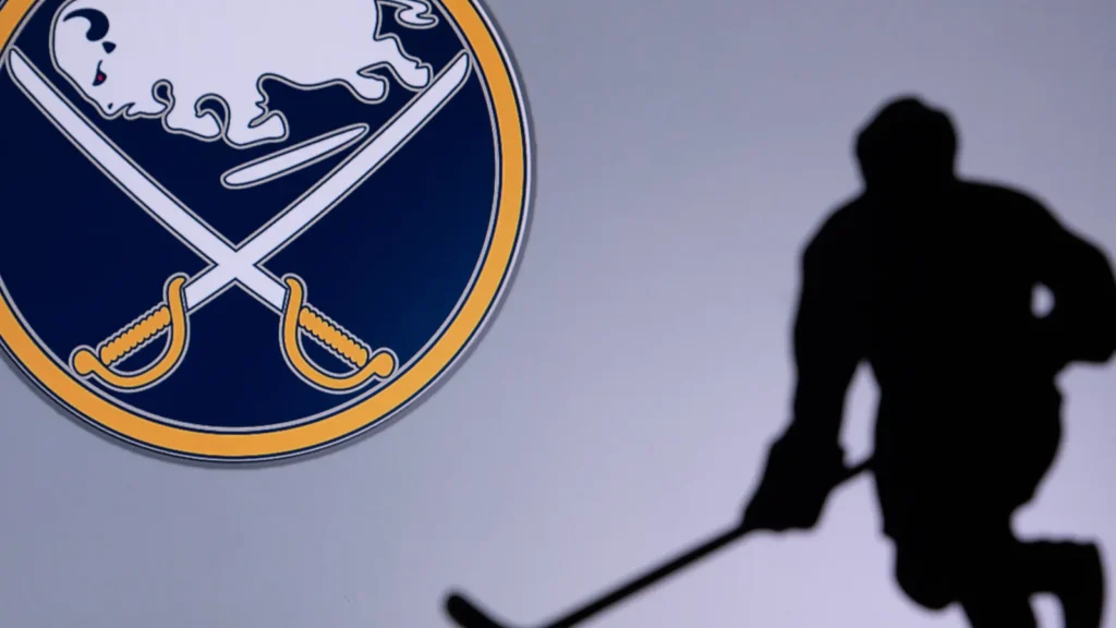 Silhouette of a player next to Buffalo Sabres logo