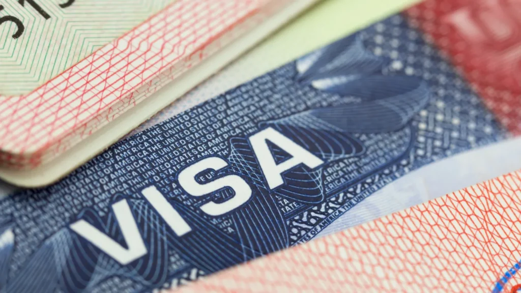 USA visa in a passport background.