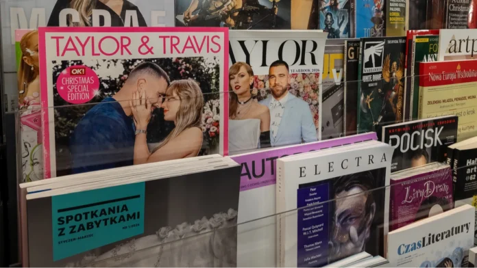 WARSAW POLAND  JANUARY 5 2026 A display shelf in a press store featuring pop culture music and gaming magazines Prominent covers include special editions dedicated to Taylor Swift and Travis Kelce Tate McRae and gaming titles like Game Boy X