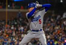 Freddie Freeman shuts down the possibility of joining another team Freddie Freeman in action during a baseball game.