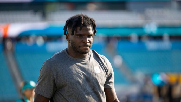 Shutterstock_Tyreek Hill_ 2354930791 NFL player Tyreek Hill outdoors.