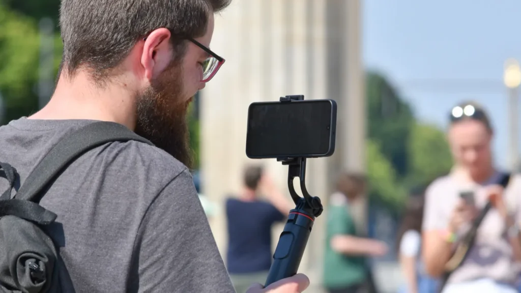A vlogger with a smartphone vlogging kit