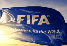 FIFA logo with it's slogan on a flag