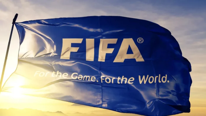 fifa logo with slogan flag textile cloth fabric waving on FIFA logo with it's slogan on a flag